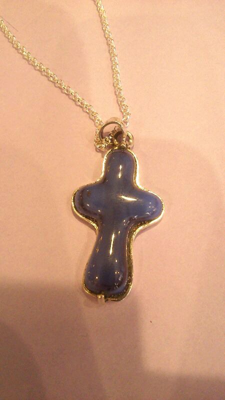 cruz en vidrio y plata